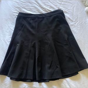 pleated black midi/mini skirt.